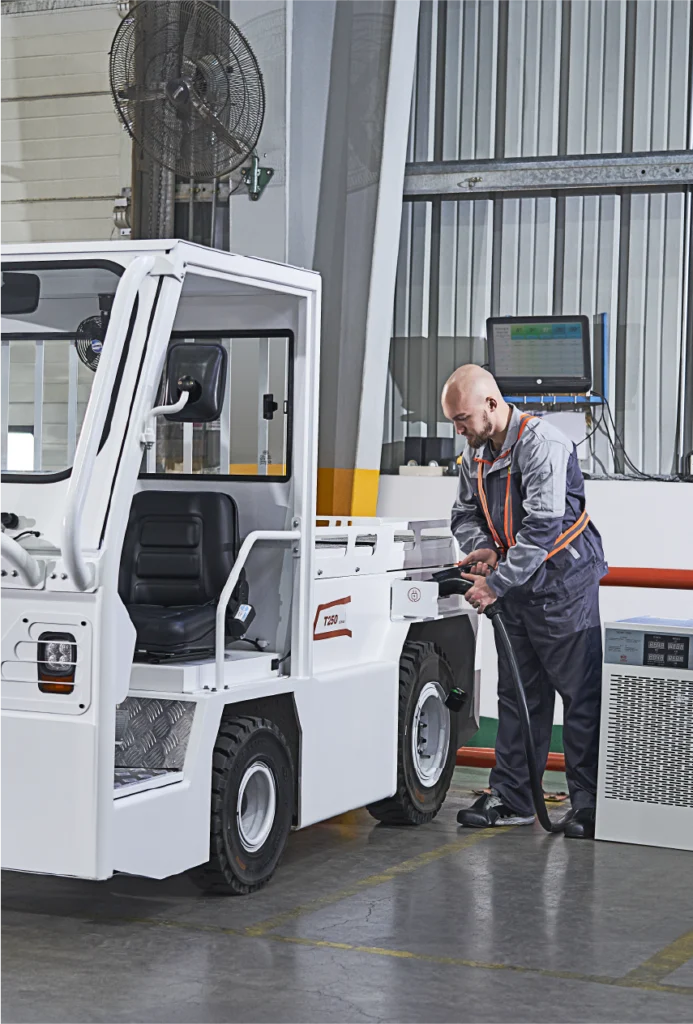 An image of a man charging a forklift