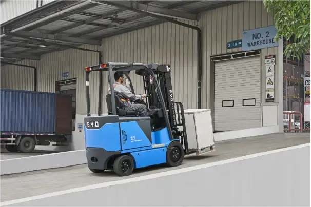 An image of a forklift carrying a box