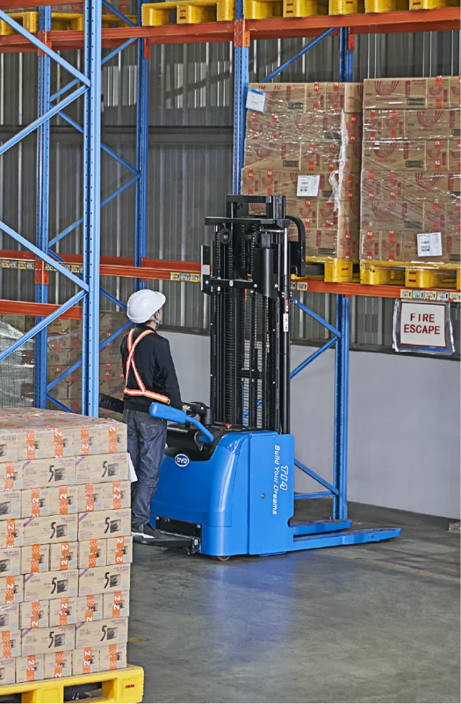 An image of an electric stacker used for stacking boxes in a shelf